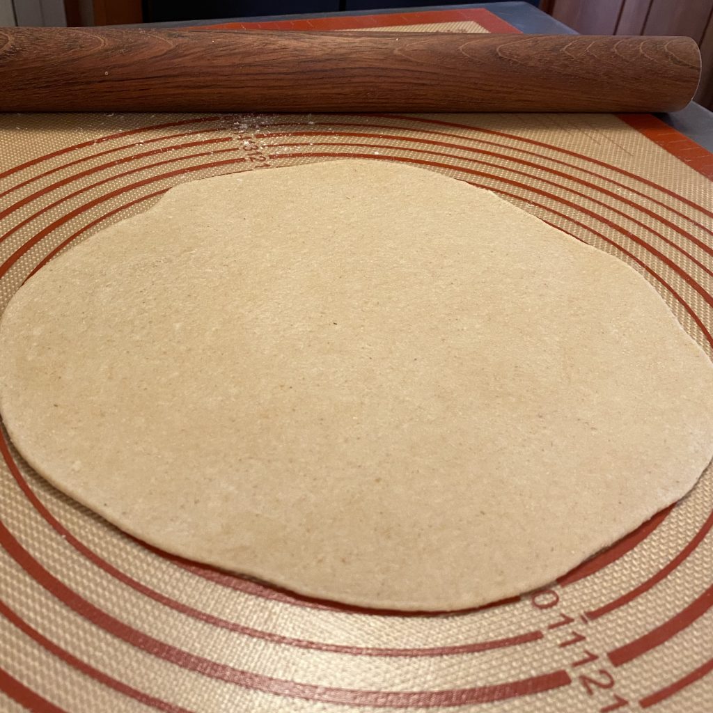 dough rolled out in 10 inch circle