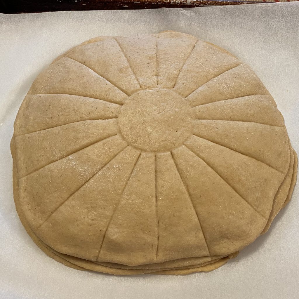 4 layers of dough scored in 16 slices